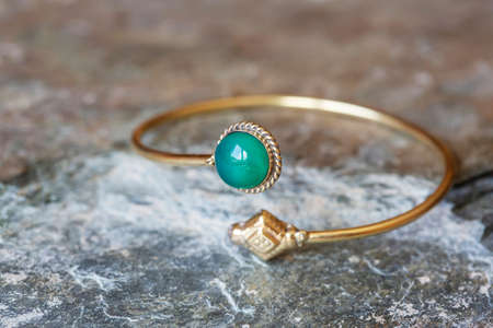 Brass bracelet with mineral gemstone decorative detail for womanの写真素材