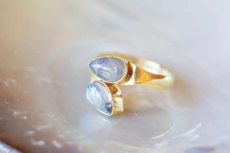 mineral stone brass ring on natural backgroundの写真素材