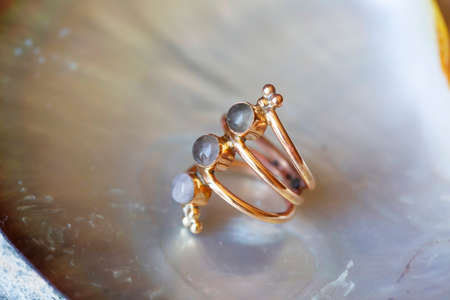 mineral stone brass ring on natural backgroundの写真素材