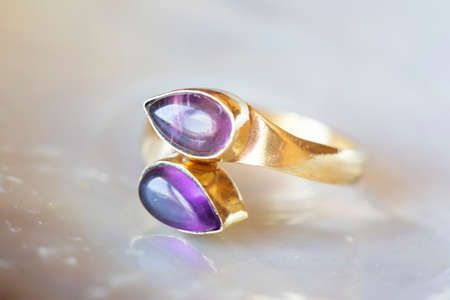 mineral stone brass ring on natural backgroundの写真素材