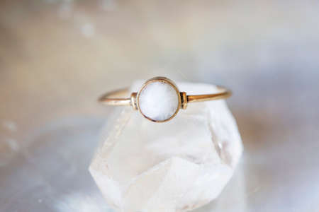 mineral stone brass ring on natural backgroundの写真素材