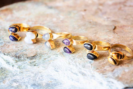 mineral stone brass ring on natural backgroundの写真素材
