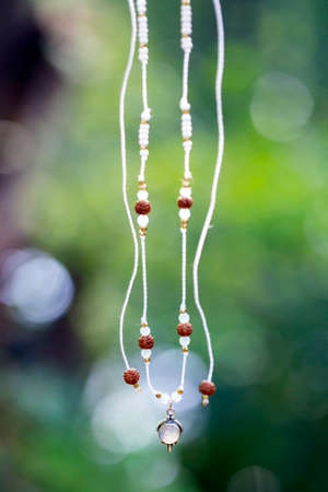 Boho necklace on natural background with white moonstoneの写真素材