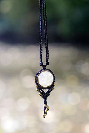 Boho necklace on natural background with white moonstoneの写真素材