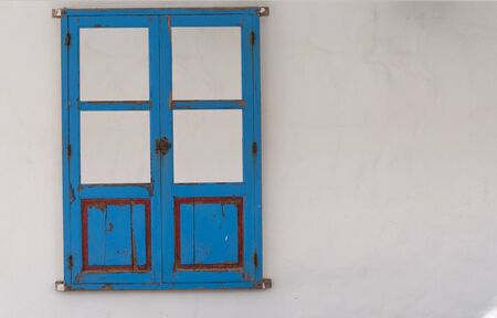 Window of a house in the island of Formentera, Mediterranean sea, Spain. In the background a white...
