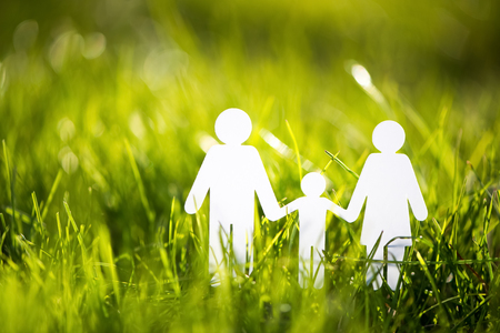 Paper family on green grassの写真素材