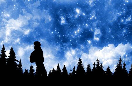 Person with backpack watching the stars in night sky above the pine forestの写真素材
