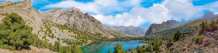Panoramic view of Alaudin lake with turquoise water on a rocky mountain background. Fann Mountains,Tajikistan, Central Asiaの写真素材