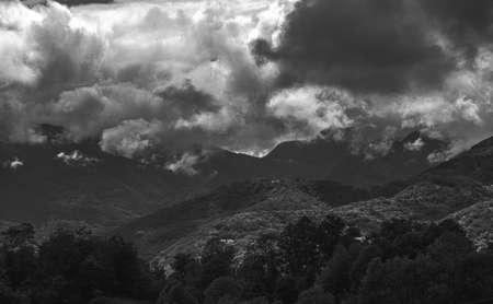 Mysterious black mountain with dramatic cloudy sky