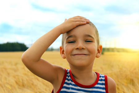 Boy in a wheat fieldの写真素材