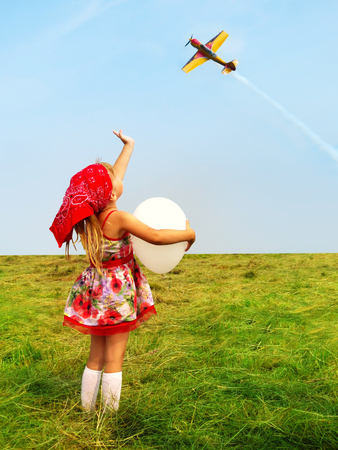little girl with a balloon.の写真素材