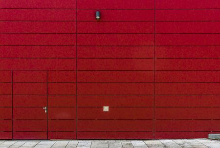Modern facade clad in striking red elements