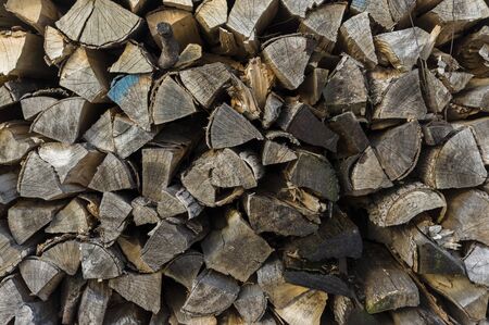 Wood stack of neatly stacked firewood and small wood to dry for firewood, firewood, raw material, wood rentalの写真素材