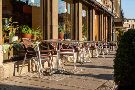 Empty and closed street cafe and almost deserted streets during the Corona Covid-19 pandemic in March 2020 in Germany in the city of Schweinfurtのeditorial素材