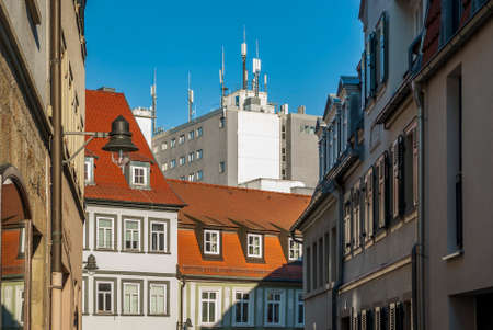 Old town alley with renovated houses background modern business building in Schweinfurt, Bavaria, Germanyのeditorial素材