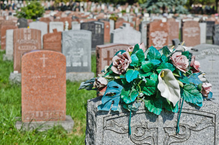 Gravestones and flowers in Montreal Cemeteryのeditorial素材
