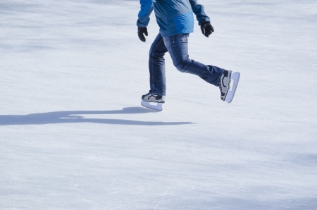 Man skating on a frozen lake