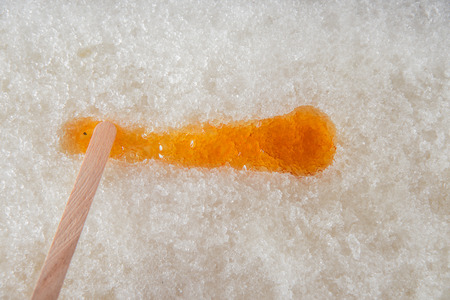 Maple taffy on snow during sugar shack period. In Quebec, Canada.の写真素材