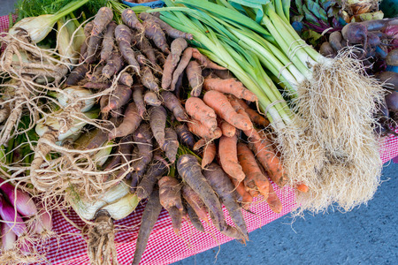 Display of leek and rare heirloom carrots at the local food market