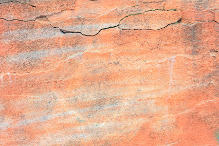 Texture of a cement salmon pink wallの写真素材