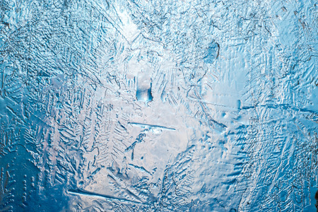 Through a transparent and melting layer of iceの写真素材