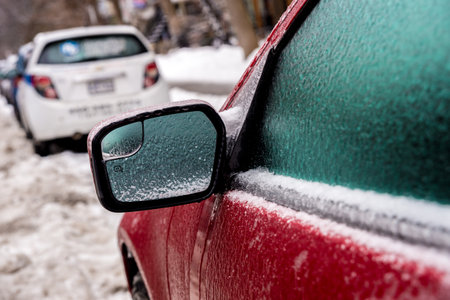 Montreal, CA, 29th February 2016. Car mirror and windows are covered with ice after freezing rain.のeditorial素材