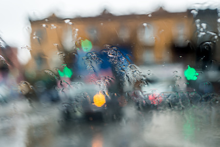 Blurred picture of traffic through a car windscreen during heavy rain.の写真素材