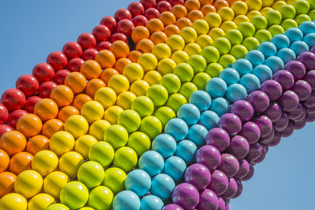 Detail of a rainbow made of balls, showing gay colorsの写真素材