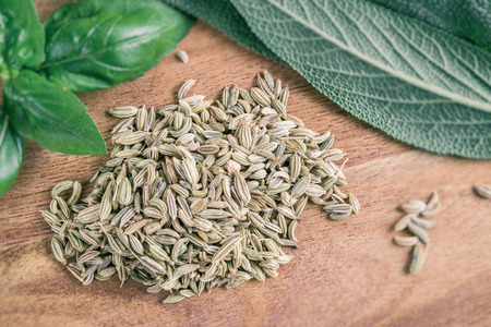 Fennel seeds on a cutting board with faded effectの写真素材