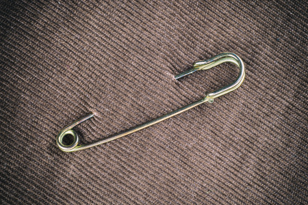 Safety pin on clothes as a symbol of solidarityの写真素材