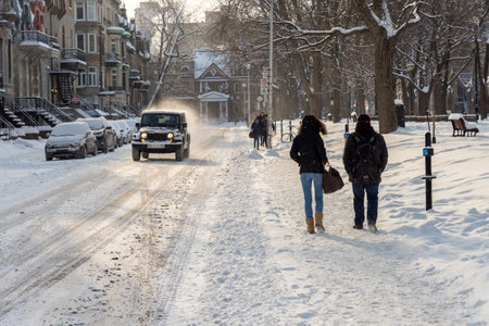 Montreal, CA - 17 December 2016: Snowstorm in Montreal. Pedestrians walking near Square Saint-Louisのeditorial素材