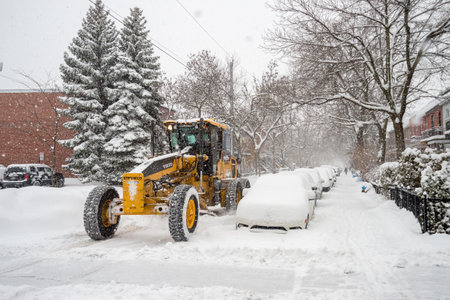 Montreal, CA - 19 December 2016: A snowplow in motion on Marquette Street during snow storm.のeditorial素材