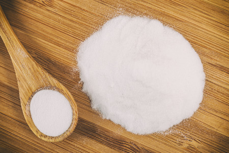 Baking soda in a wooden spoonの写真素材