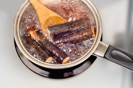 Mysterious roots boiling in a saucepan.の写真素材