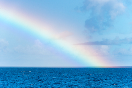 Rainbow over the Caribbean Sea in Martiniqueの写真素材