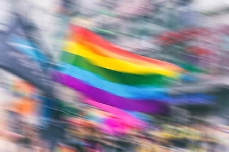 Abstract motion blurred picture of a gay rainbow flag during a pride parade. Concept of LGBT rights.の写真素材
