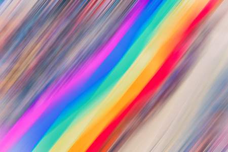 Motion blurred picture of gay rainbow flags during pride parade. Concept of LGBT rights.の写真素材