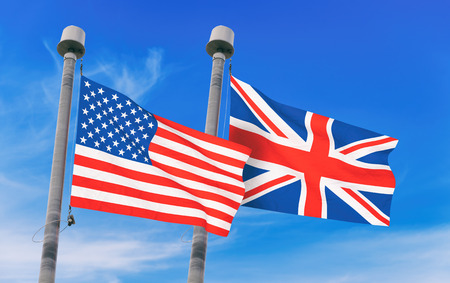 United Kingdom and USA flags over blue sky background (3D rendered illustration)の写真素材