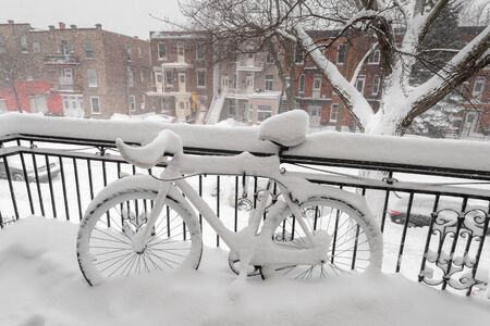 Bike covered with fresh snow in Montreal, Canada (January 2019)の写真素材