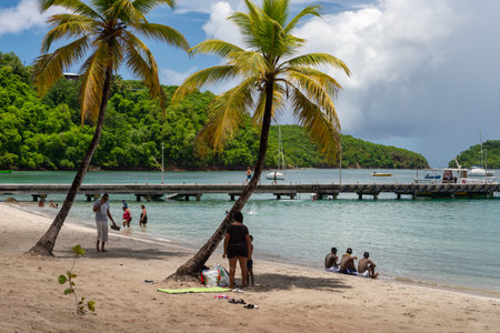 Anse-Ã -l'Ãne, Martinique, FR: 22 August 2019: People enjoying a warm day at Anse-Ã -l'Ãne Beach.のeditorial素材