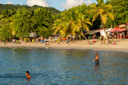 Anse-Ã -l'Ãne, Martinique, FR: 22 August 2019: People enjoying a warm day at Anse-Ã -l'Ãne Beach.のeditorial素材
