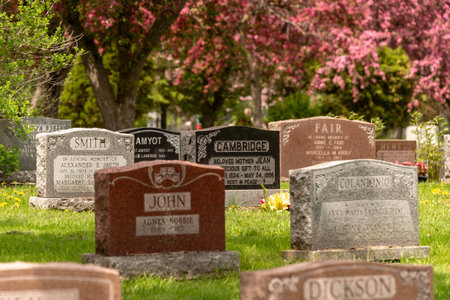 Montreal, CA - 30 May 2019: Headstones in Montreal cemetery in the Springtimeのeditorial素材