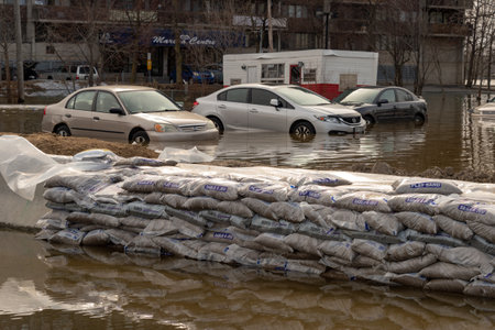 Pierrefonds-Roxboro, Quebec, Canada - 29 April 2019: Cars submerged during spring floodsのeditorial素材
