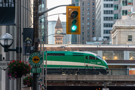 Toronto, CA - 22 June 2019: Picture of a GO Transit green train as seen from Bay street.のeditorial素材