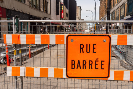 Montreal, Canada - 03 September 2019: Construction site on Sainte-Catherine street. "Rue BarrÃ©e" means closed road in french.のeditorial素材