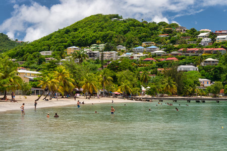 Anse-Ã -l'Ãne, Martinique, FR: 22 August 2019: People enjoying a warm day at Anse-Ã -l'Ãne Beach.のeditorial素材