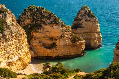 Empty beach and cliffs in Lagos, Portugalの写真素材