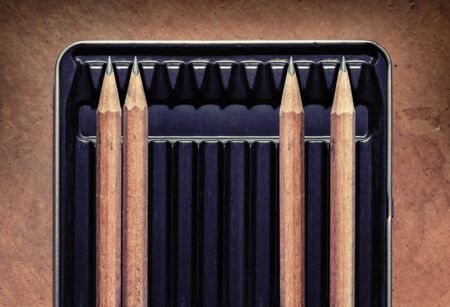 Wooden pencils in a box with spaces between them. Concept picture for social distancing.の写真素材