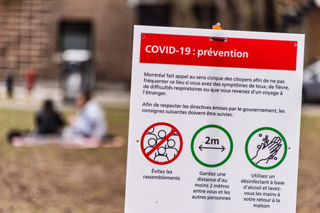 Montreal, CA - 8 May 2020 : Sign showing french Covid-19 safety guidelines at the entrance of a Park.のeditorial素材
