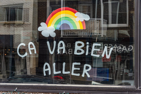 Montreal, CA - 27 April 2020: Ca va bien aller (Its going to be ok) message and rainbow drawing in a window during the Covid 19 pandemy Montreal, CA - 27 April 2020: Ca va bien aller (Its going to be ok) message and rainbow drawing in a window during the Covid 19 pandemy